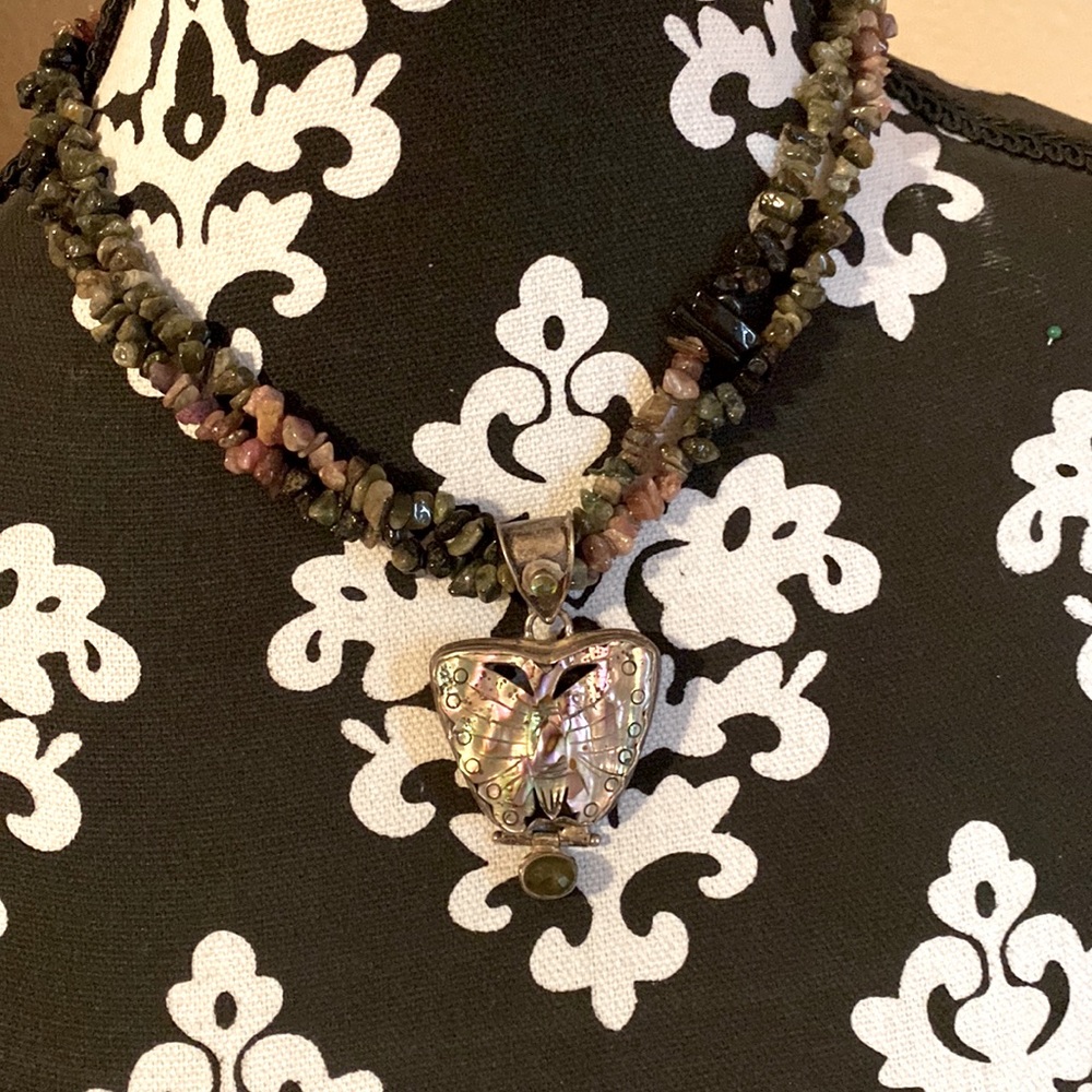 Beautiful butterfly shaped abalone with peridot,green,pink and black tourmaline